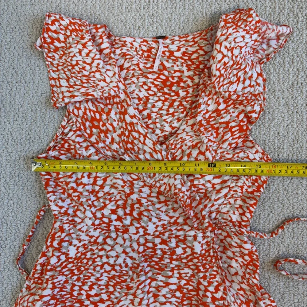 Free People French Quarter mini wrap dress, Small Orange White Animal Print boho